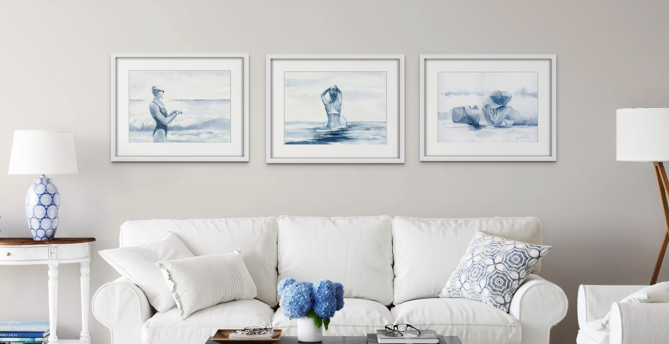 Three watercolour paintings of an ocean swimmer, a surfer and a sunbather. Coastal wall art.